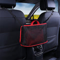 Car net pocket holding a red handbag between seats