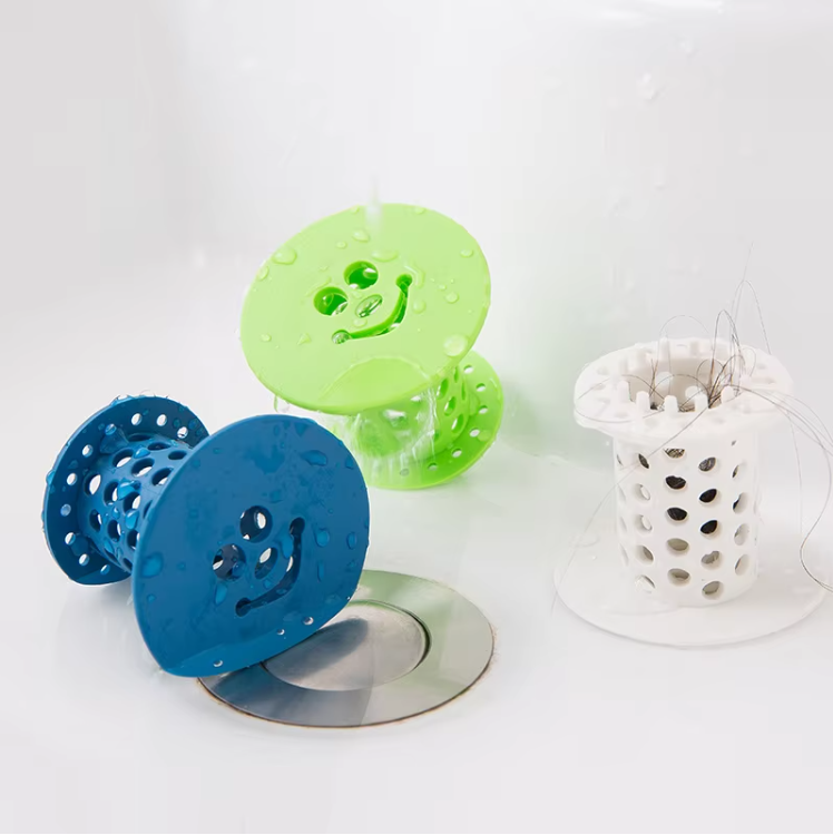 Silicone in-drain hair catchers in blue, green and white