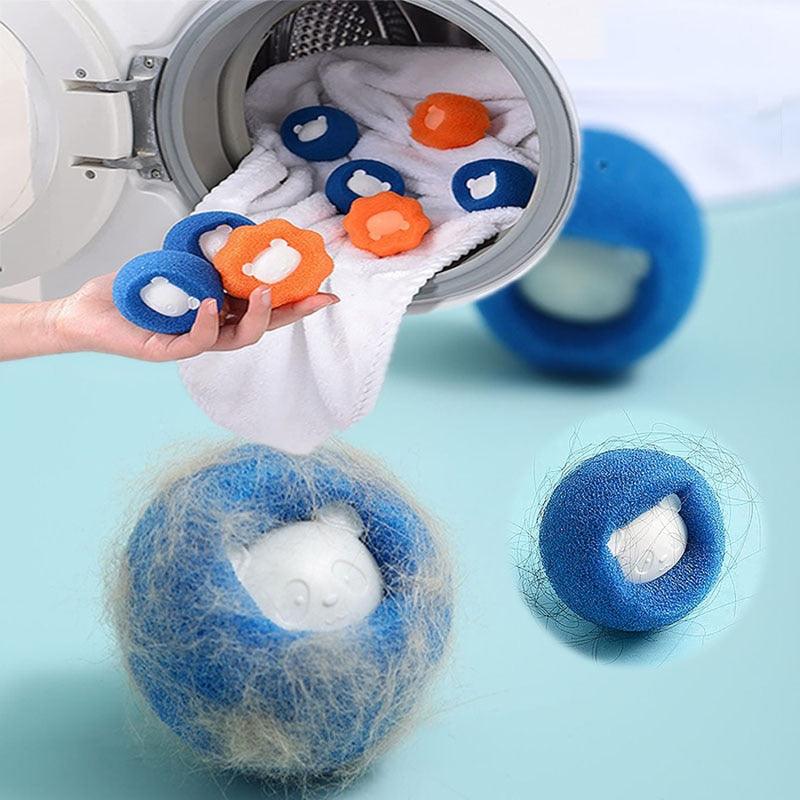 Blue and orange pet hair laundry balls going into a washing machine