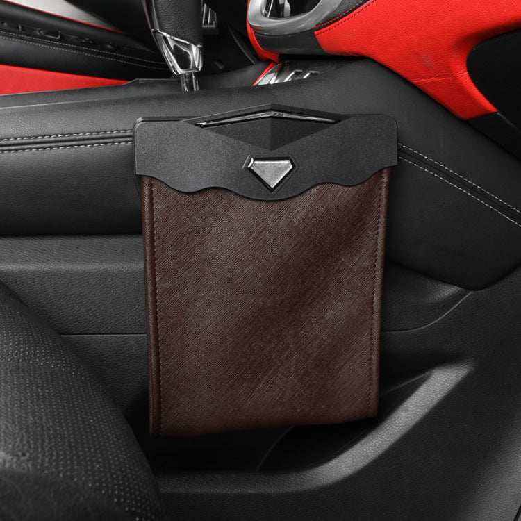Brown leather-look hanging car trash bin attached to a car door